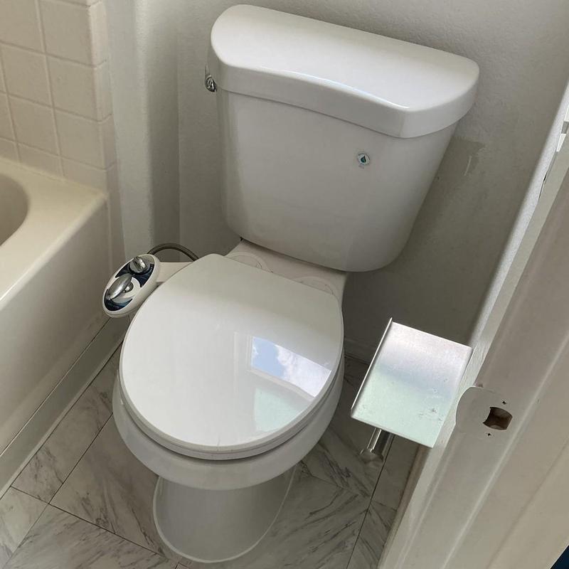 Toilet installation with new wax ring and closet bolts