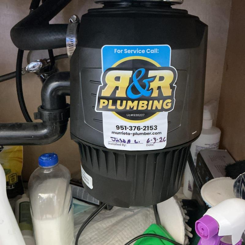 Garbage disposal unit installed under kitchen sink