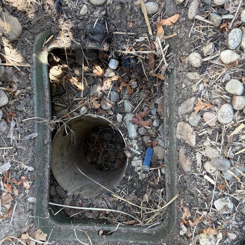 Irrigation backflow preventer buried valve box exposed