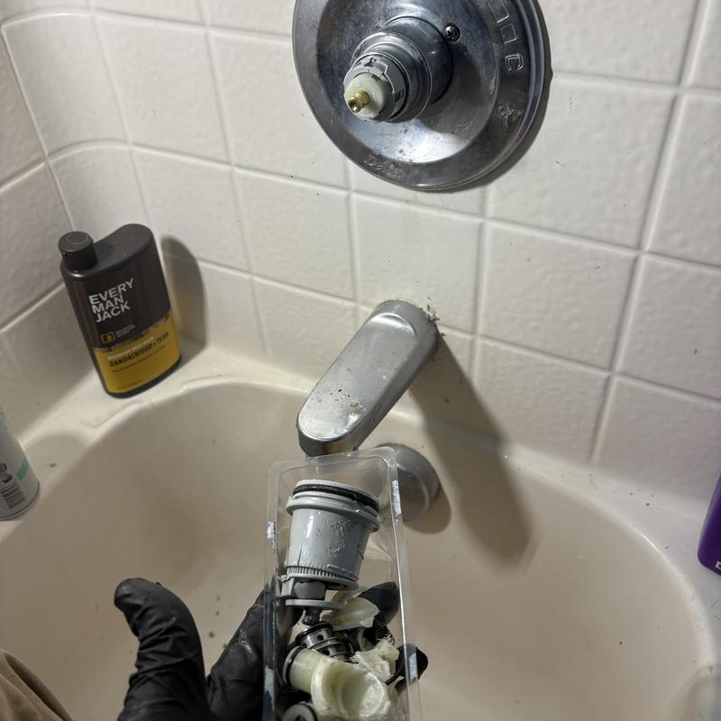 Tub spout diverter valve removal in bathtub maintenance
