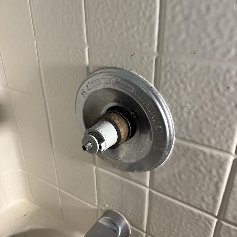 Shower valve cartridge replacement in tiled wall