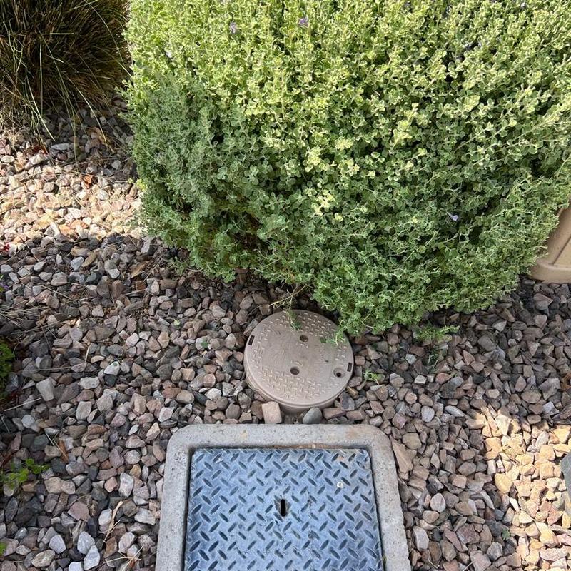 Pressure-reducing valve and landscaping valve box in gravel