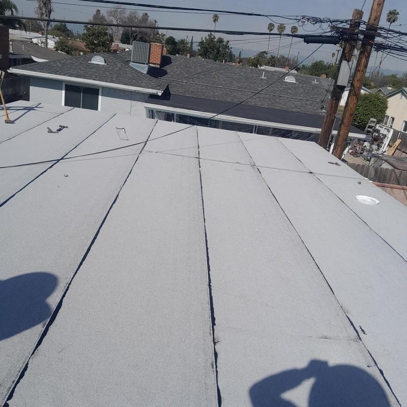 Flat roofing membrane installation on residential building Flat roofing membrane installation on residential building