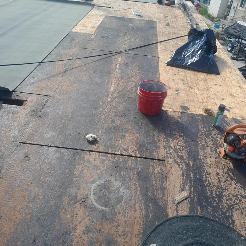Flat roof plywood decking with roofing tools Flat roof plywood decking with roofing tools