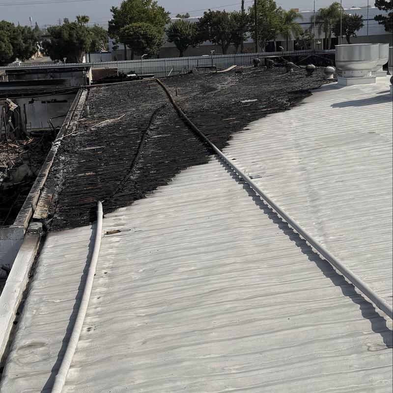 Metal roof with partial fire damage and replacement panels Metal roof with partial fire damage and replacement panels