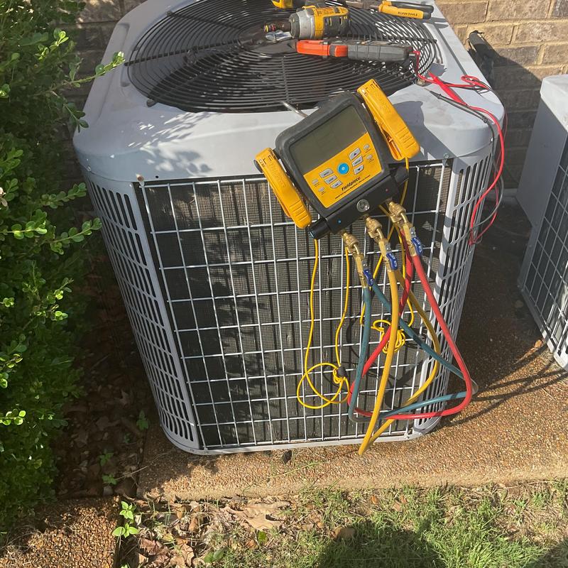Condenser unit with HVAC gauges and power tools Condenser unit with HVAC gauges and power tools