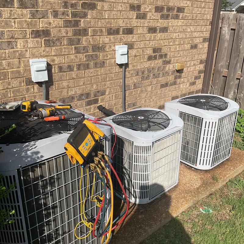 Condenser units with diagnostic gauges and tools outside Condenser units with diagnostic gauges and tools outside