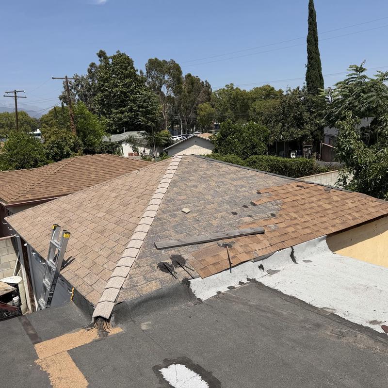 Asphalt shingle roof with repair materials and ladder Asphalt shingle roof with repair materials and ladder