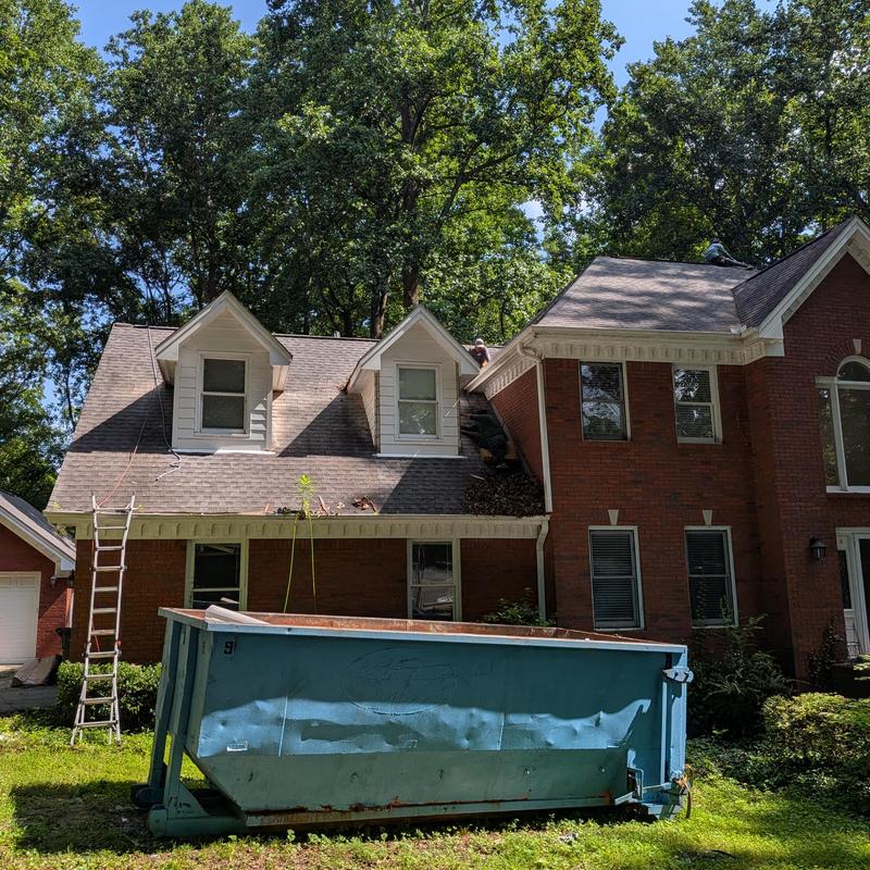 Dormer corner boards with roof workers in Madison, AL