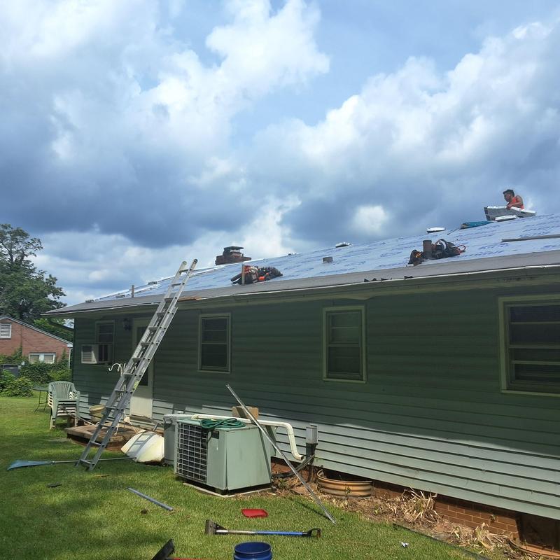 Residential roof underlayment installation with ladder access Residential roof underlayment installation with ladder access