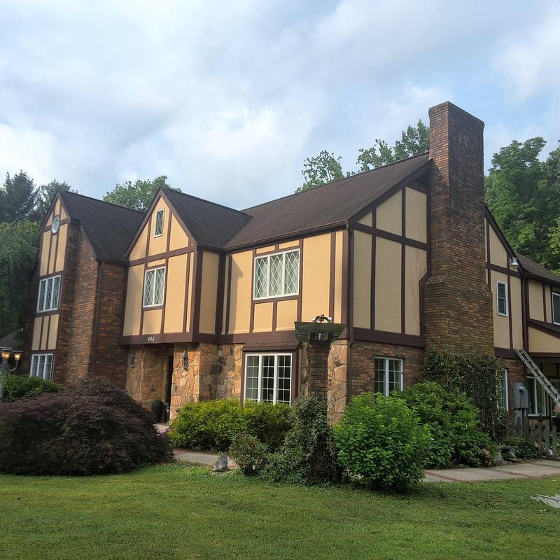 Asphalt shingle roof inspection on Tudor-style home Asphalt shingle roof inspection on Tudor-style home
