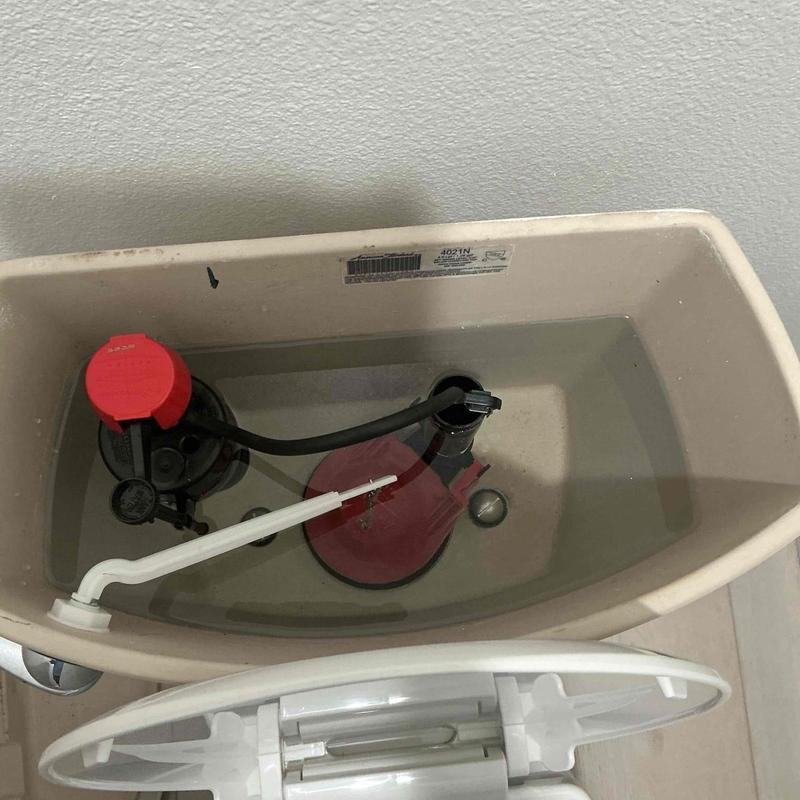 Toilet fill valve and flapper inside tank