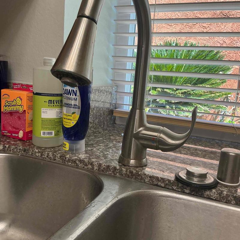 Kitchen faucet with sprayer on granite countertop