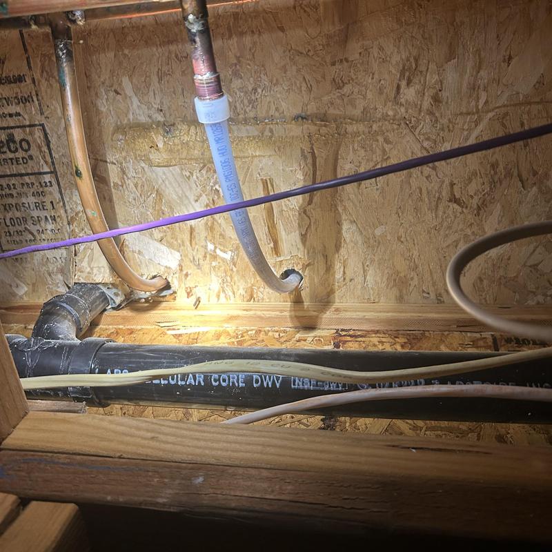 PEX A piping installation with copper connections in wall cavity