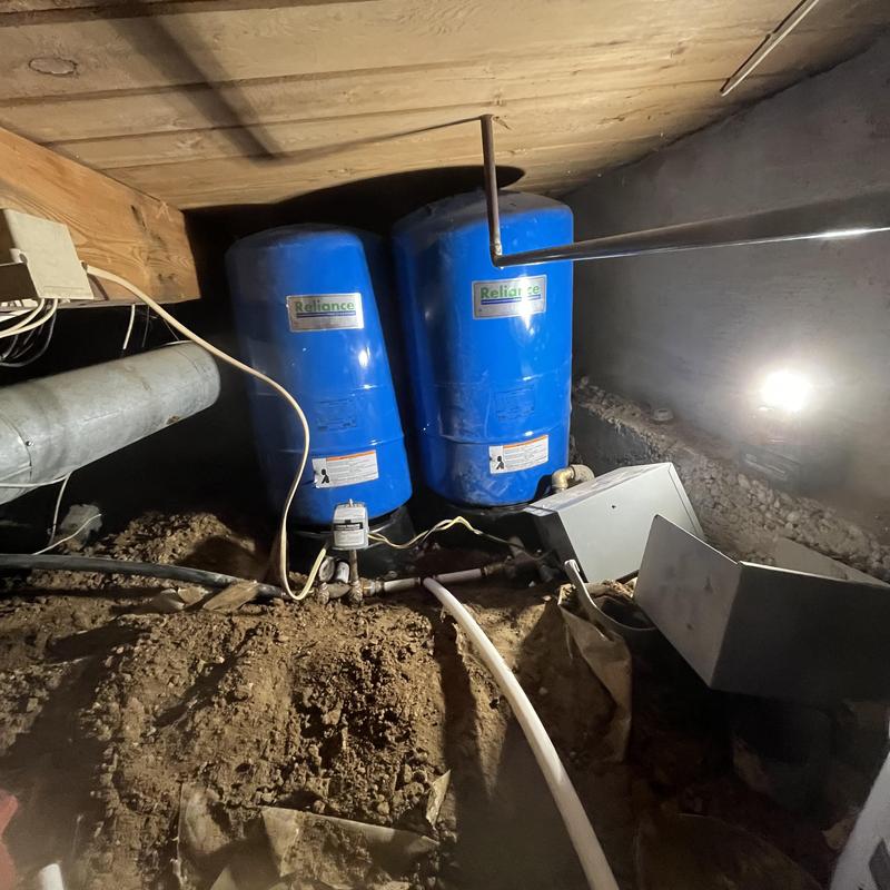 Well pressure tanks installation in crawl space