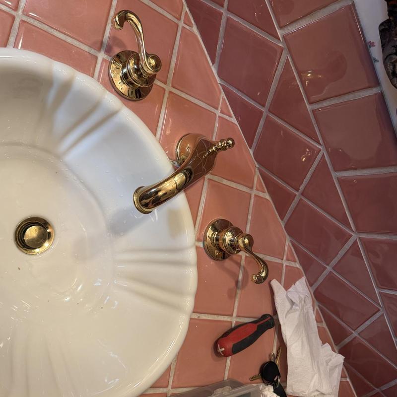 Bathroom sink cold water handle with gold faucet Bathroom sink cold water handle with gold faucet