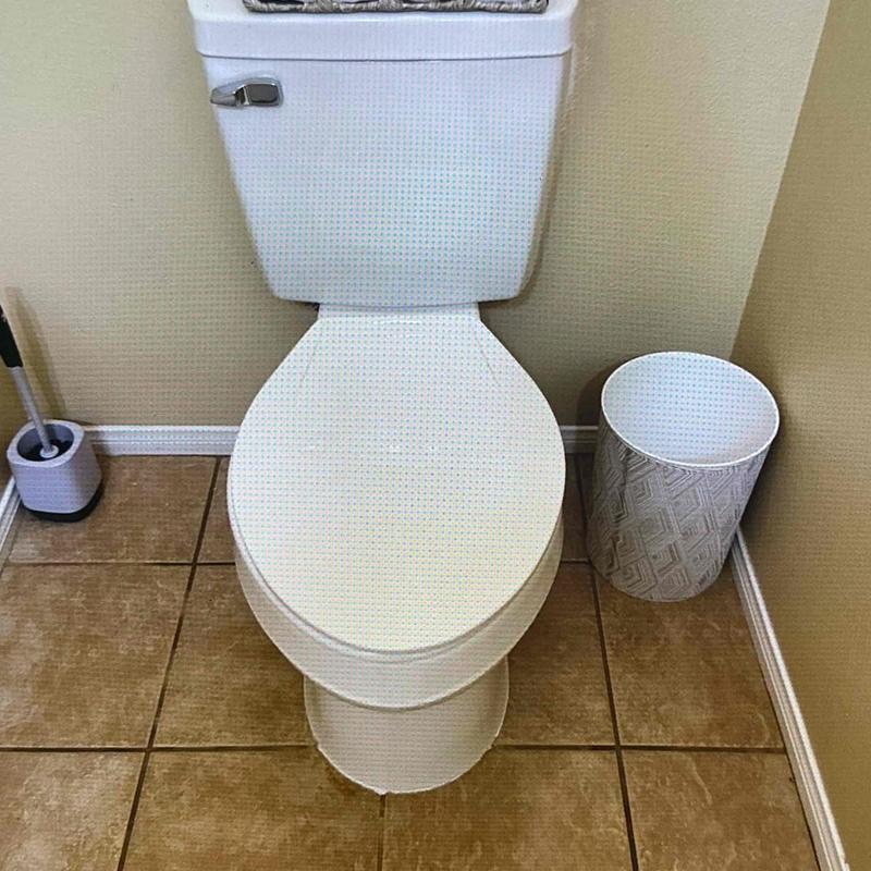 Two-piece elongated toilet with toilet brush and wastebasket