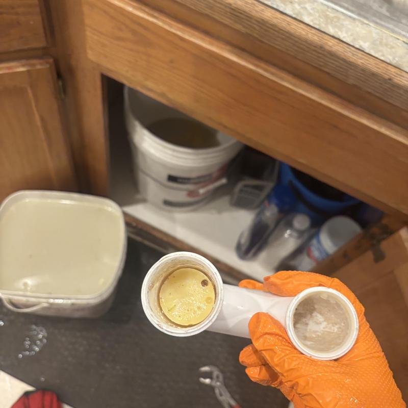 Kitchen sink drain pipe clogged with grease buildup