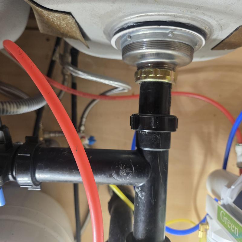 Kitchen sink basket strainer and drain piping installation