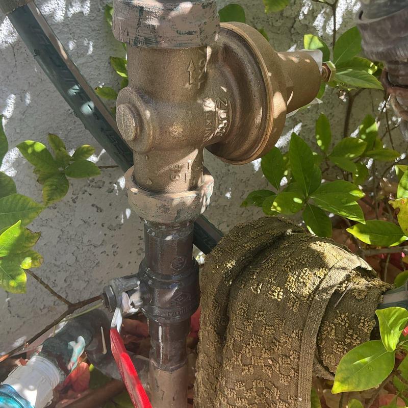 Pressure regulator valve on outdoor plumbing line