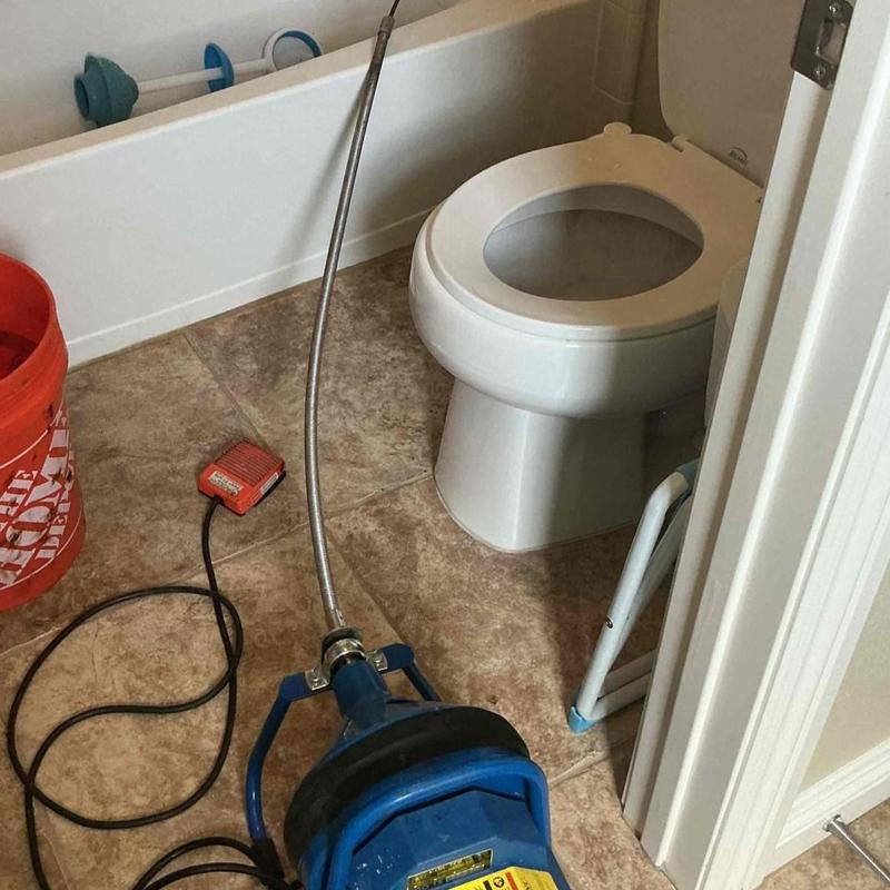 Bathtub drain clearing with electric auger tool