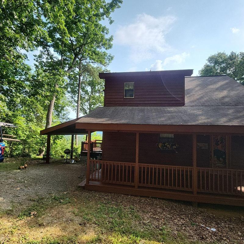 Exterior wood siding and deck staining on home