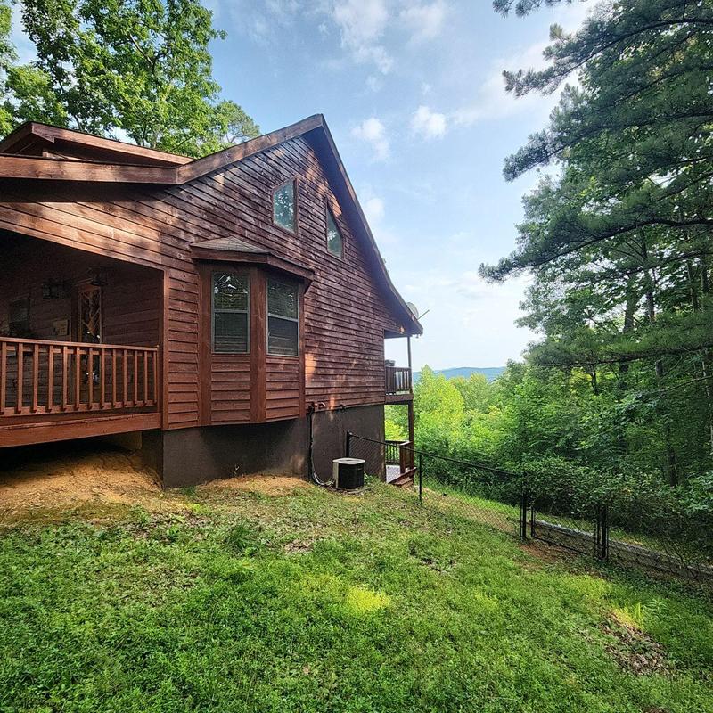 Wood siding and deck with fresh stain on house exterior