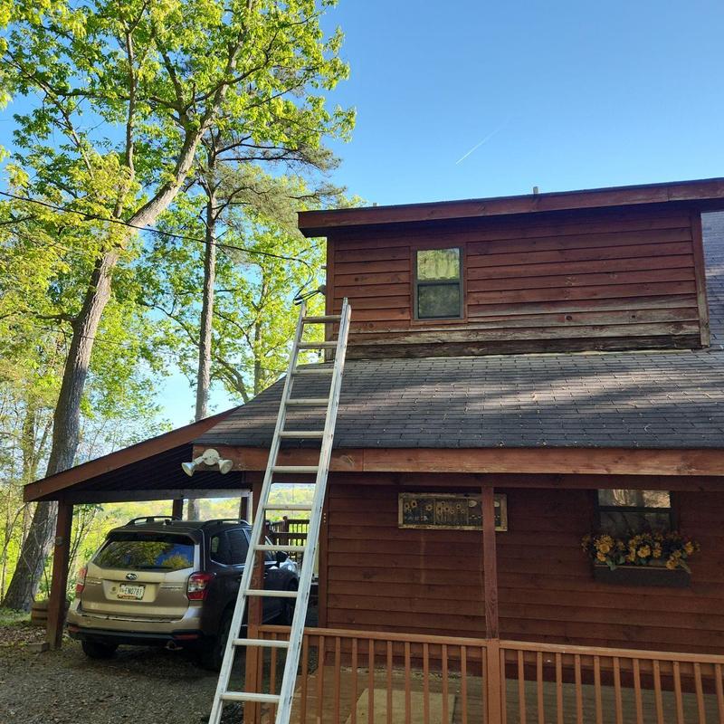 Wood siding and fascia with ladder for repair