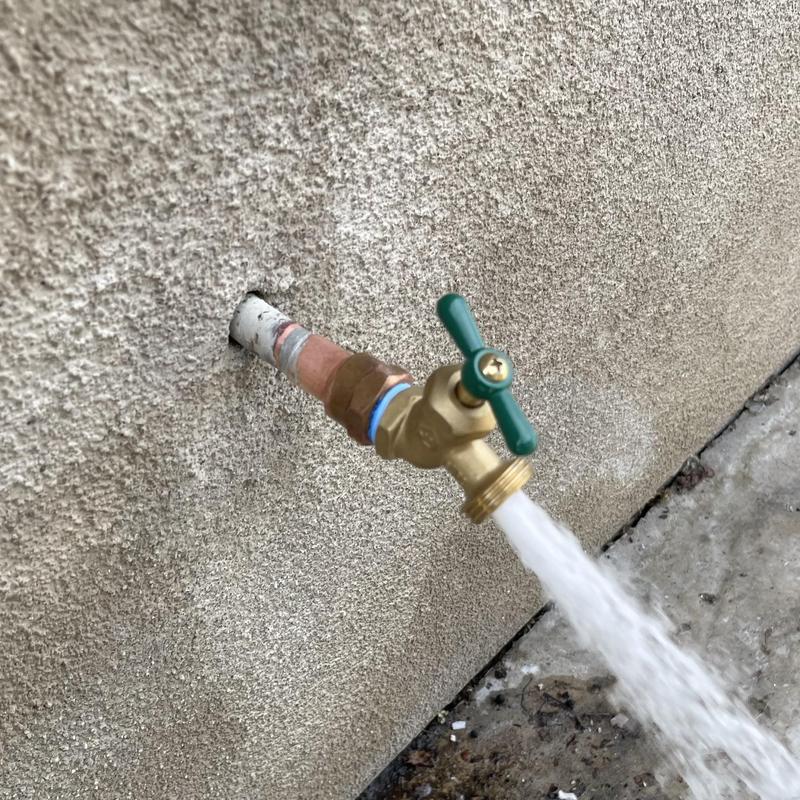 12-inch threaded hose bib with flowing water