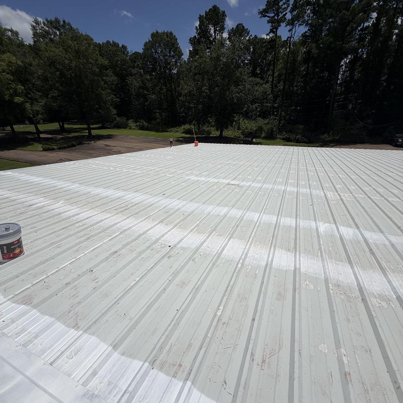 Metal roofing with white primer paint applied