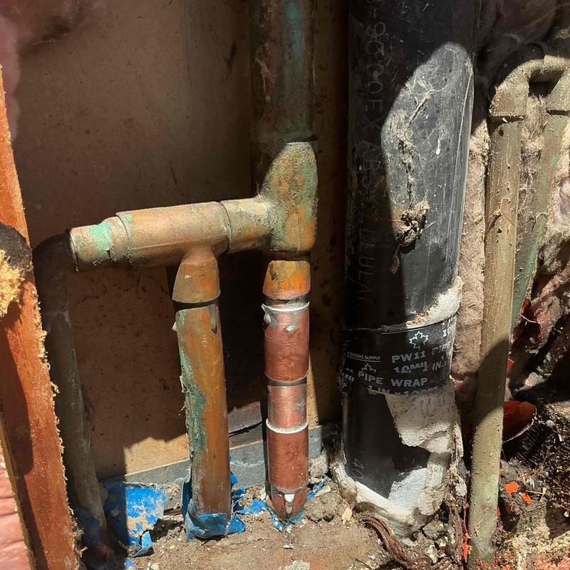 Copper plumbing pipe with replacement fittings in wall cavity
