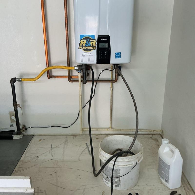 Tankless water heater flushing with bucket and vinegar
