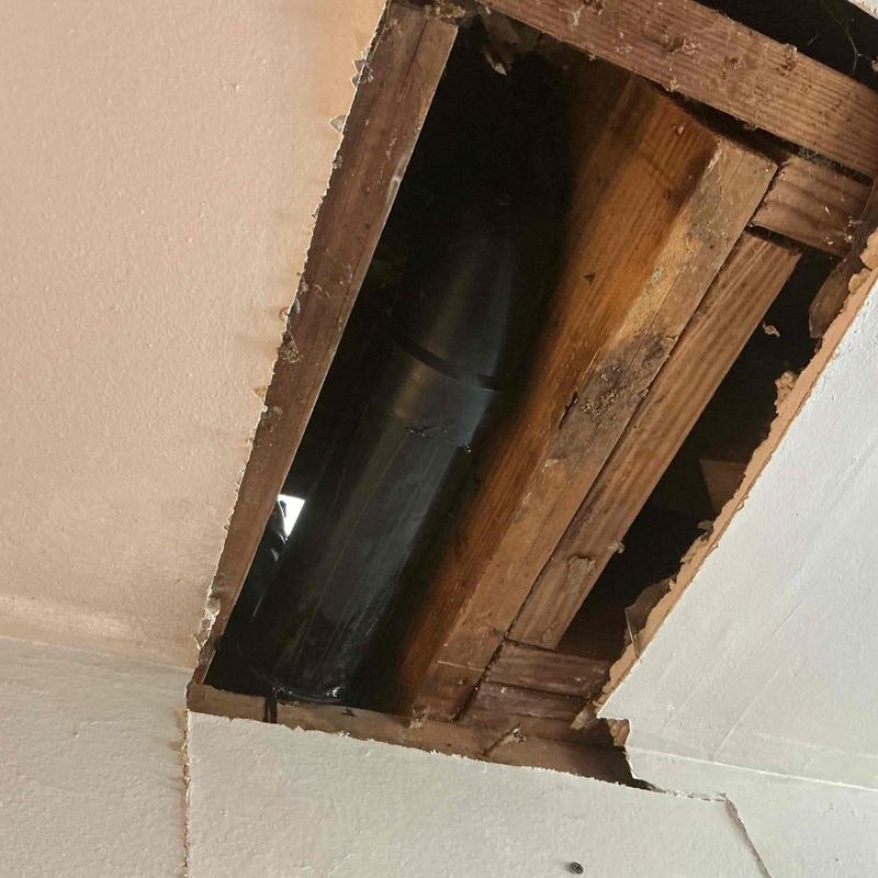 Drain pipe with new fittings in ceiling cavity