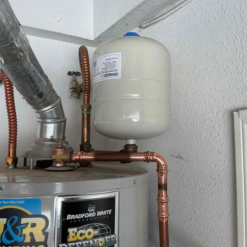 Expansion tank with copper piping on water heater