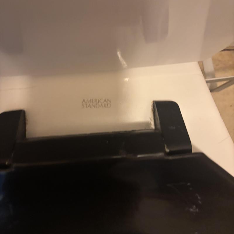 American Standard toilet with broken seat hinge