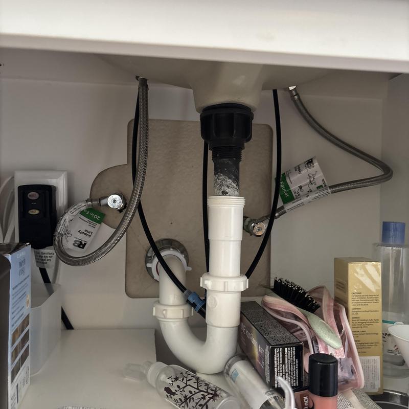 Sink drain pipe with water supply lines and hoses