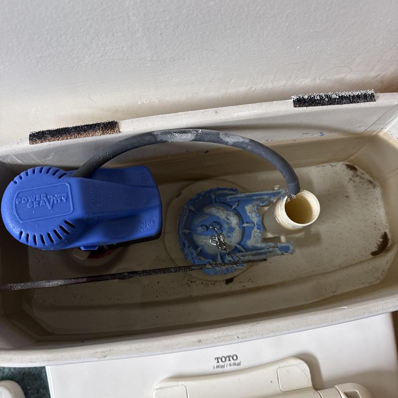 Toilet fill valve and flapper replacement in tank