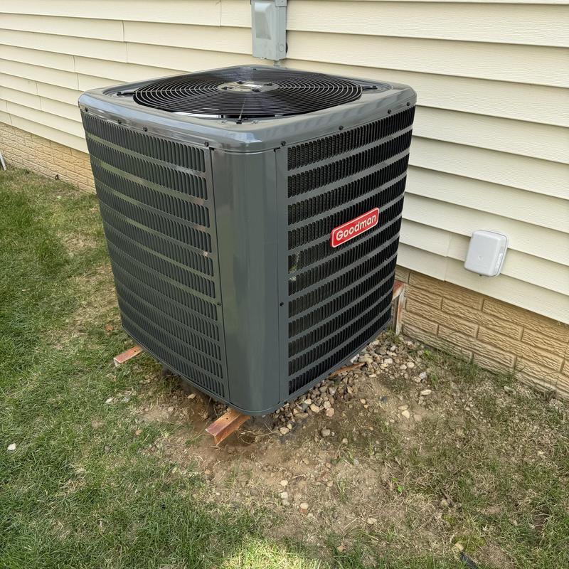 Goodman 15.2 SEER high-efficiency AC unit outdoors Goodman 15.2 SEER high-efficiency AC unit outdoors