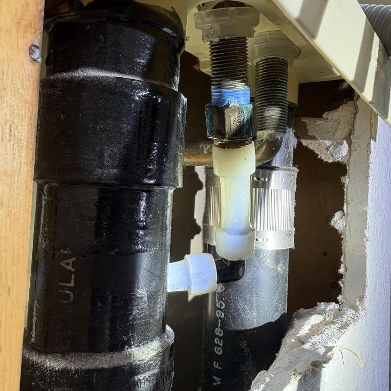 Washer valve connections and drain pipes in wall cavity