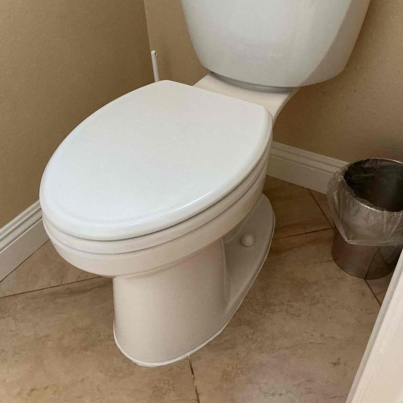 Toilet with new metal flange and wax ring installation