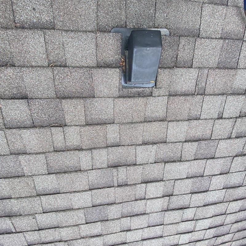 Flapper vent on asphalt shingle roof installation
