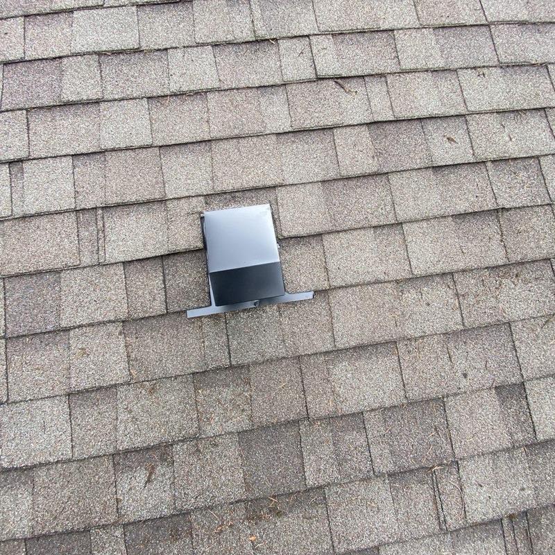 Flapper roof vent installed on asphalt shingle roof