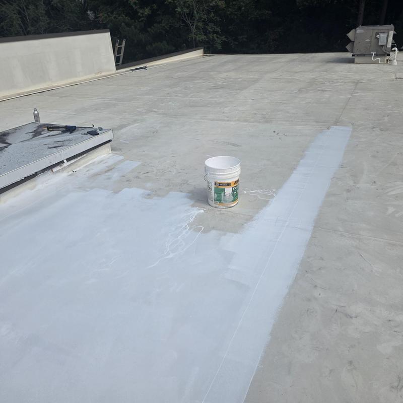 TPO roof silicone coating application at commercial roof