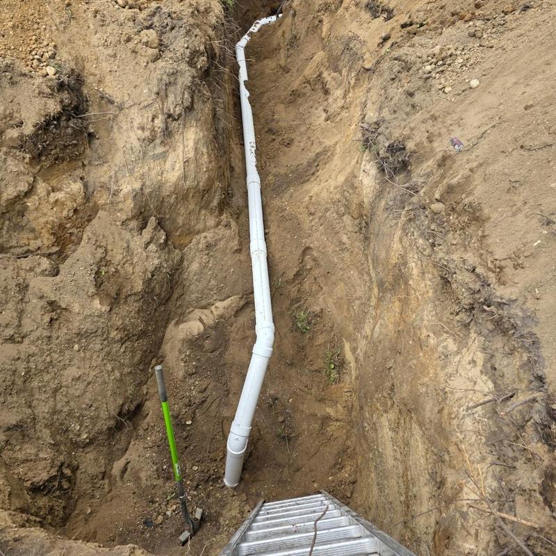 Sewer pipe relocation trench with septic bypass system