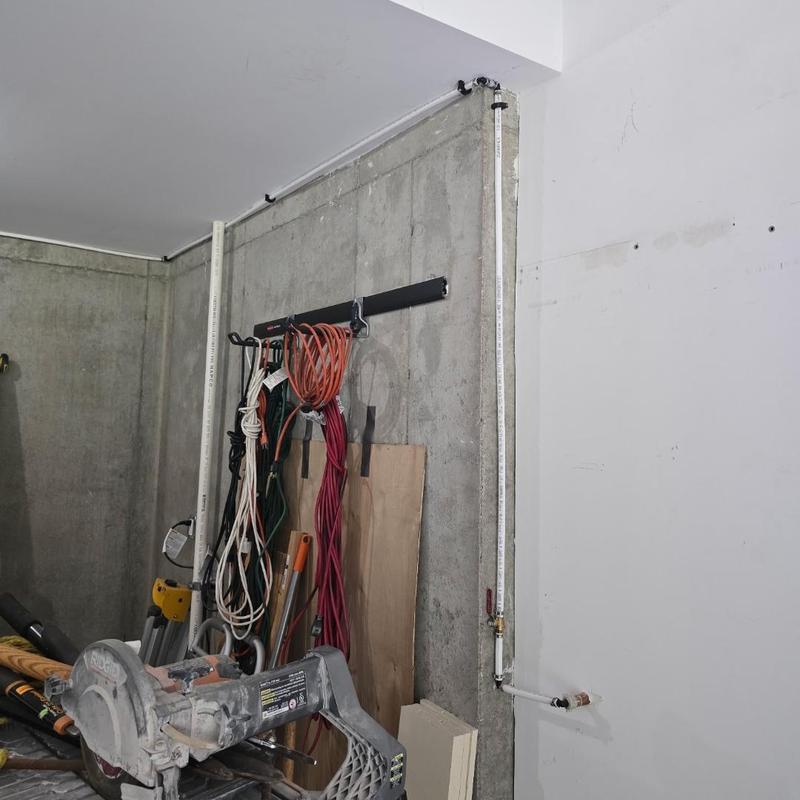 Water line and frost free silcock installed in basement wall