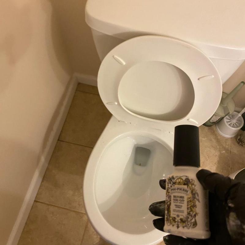 Toilet trap obstruction removal with spray bottle extraction