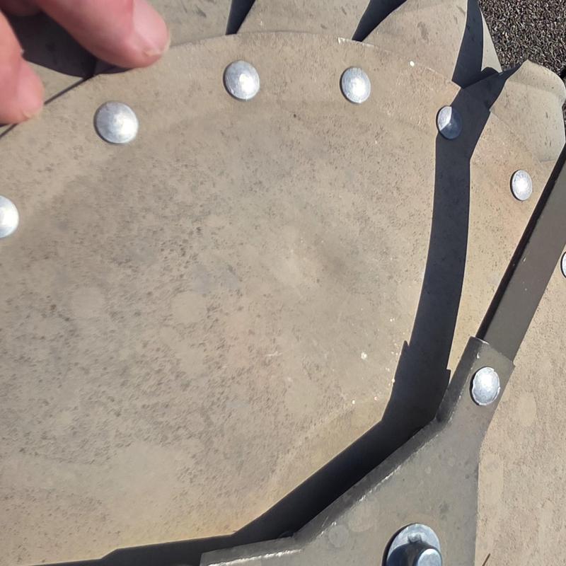 Concrete roof shingles with hail damage dents