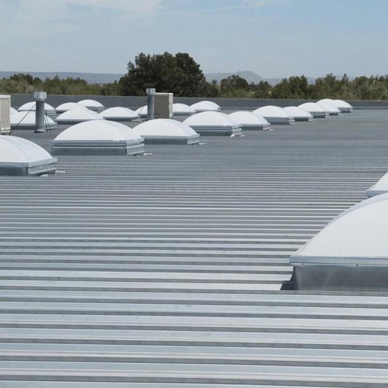 Commercial metal roof with dome skylights installation Commercial metal roof with dome skylights installation