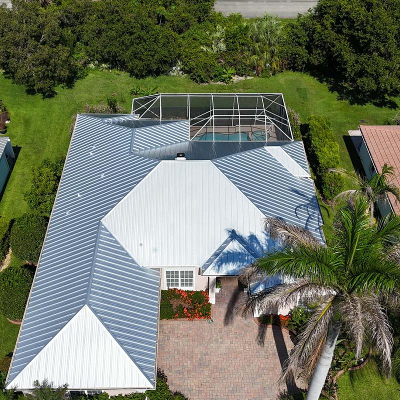 Standing seam Galvalume metal roof installation aerial view Standing seam Galvalume metal roof installation aerial view