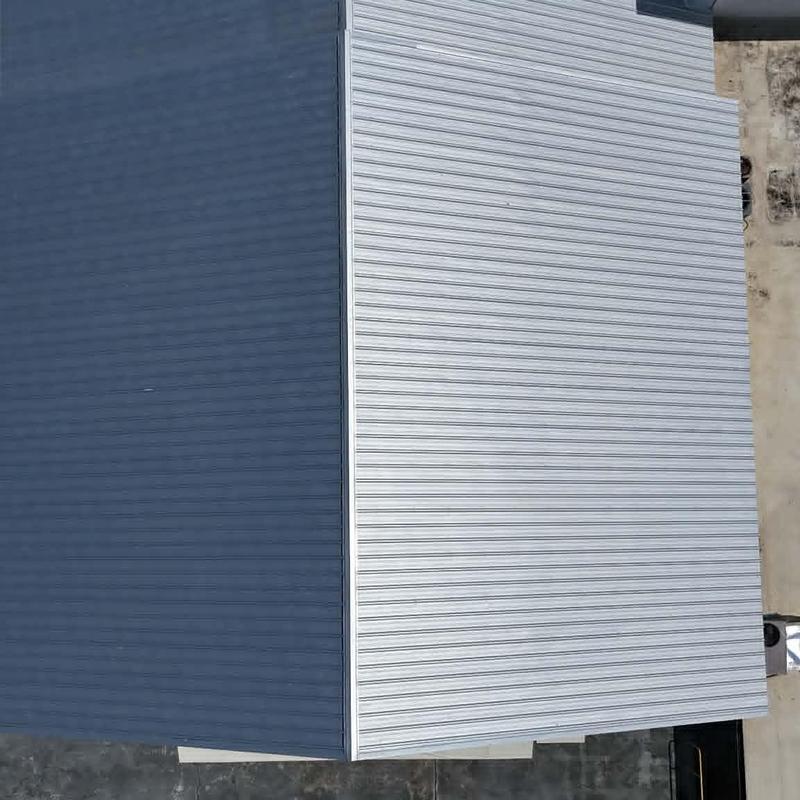 PBR metal roofing panels on commercial building roof PBR metal roofing panels on commercial building roof